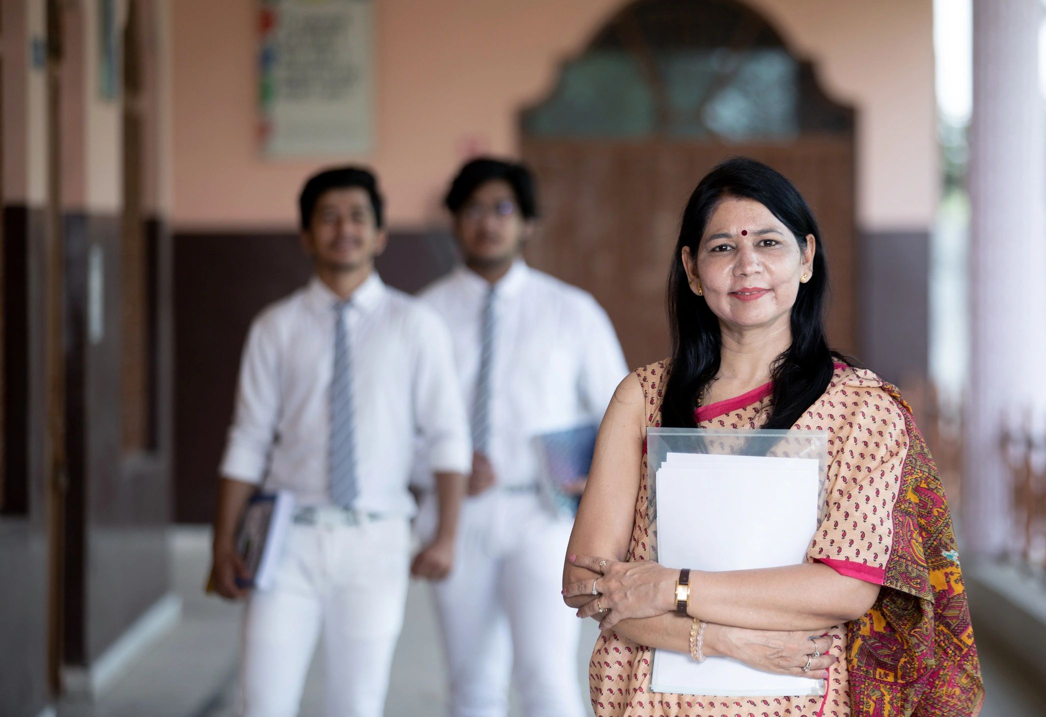 Smiling teacher with students